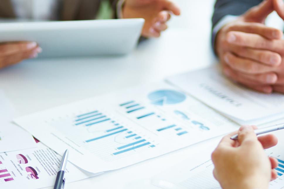 close-up-businesspeople-working-with-documents